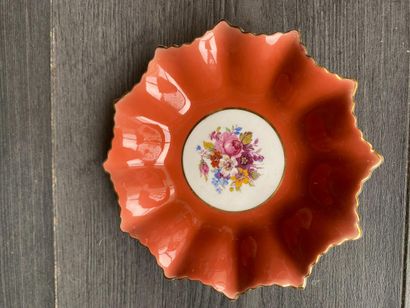 An orphaned saucer with floral decoration...