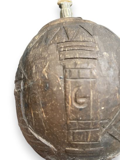 Engraved coconut-shaped flask belonging to...