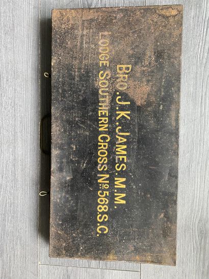 A black metal storage box with the inscription...
