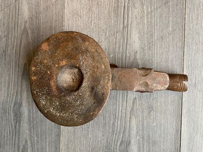 An antique metal cooking utensil for leathering...