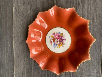 An orphaned saucer with floral decoration...