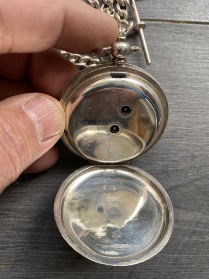A round steel masonic pocket watch with a...