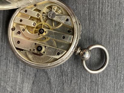 A round steel Masonic pocket watch with black...