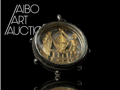 A round steel pendant medallion with openwork...