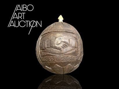 Engraved coconut-shaped flask belonging to...