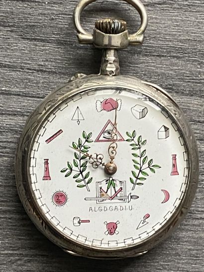 A round steel masonic pocket watch with the...