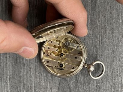A round steel Masonic pocket watch with black...
