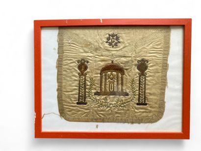 An antique French Rite apron framed in creamy...