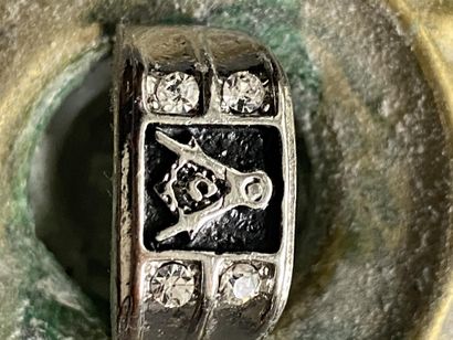 A ring with masonic motif (square & compasses...
