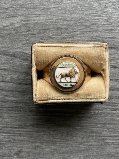 A 10 karat gold ring with enameled scene...