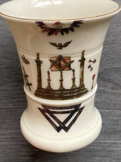 A porcelain goblet with gilded rim and painted...