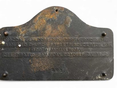 White and gray commemorative cast-iron plaque...