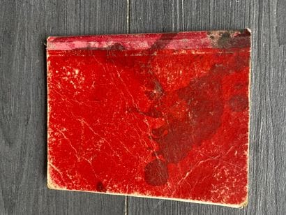 A black metal storage box with the inscription...