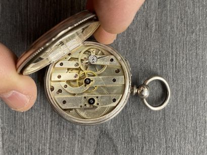 A round steel Masonic pocket watch with black...