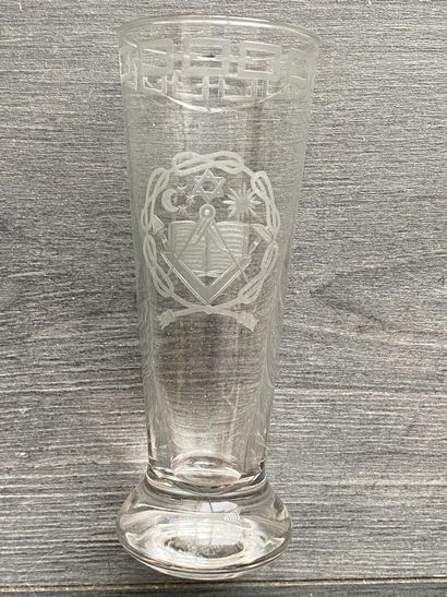Stemmed glass with engraved symbols of the...