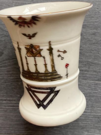 A porcelain goblet with gilded rim and painted...