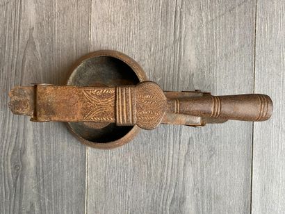 An antique metal cooking utensil for leathering...