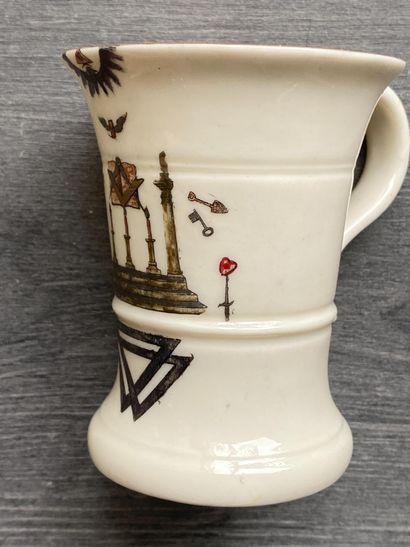 A porcelain goblet with gilded rim and painted...
