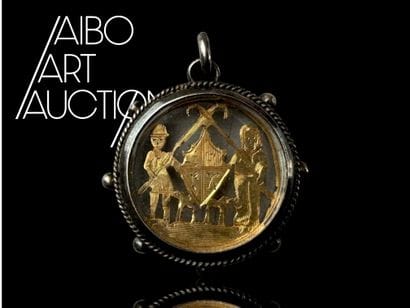 A round steel pendant medallion with openwork...