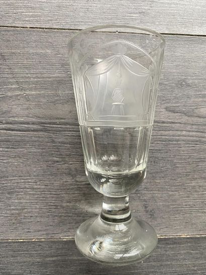 Flared stemmed glass with symbols of the...