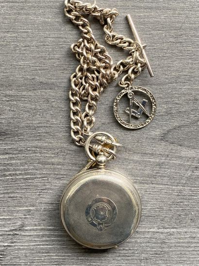A round steel masonic pocket watch with a...