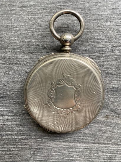 A round steel Masonic pocket watch with black...