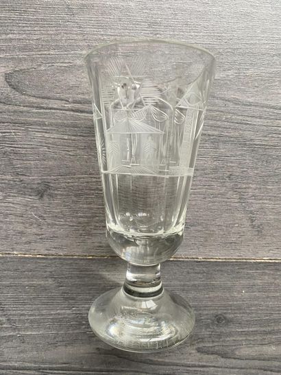 Flared stemmed glass with symbols of the...