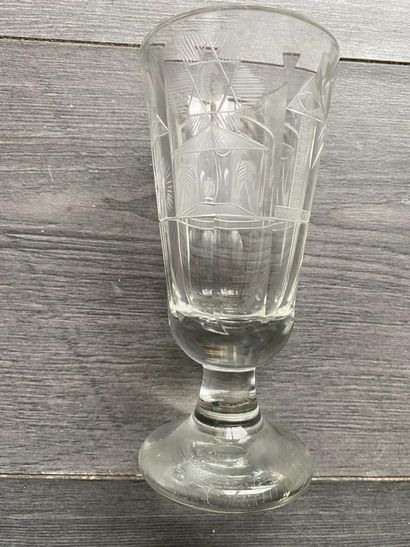 Flared stemmed glass with symbols of the...