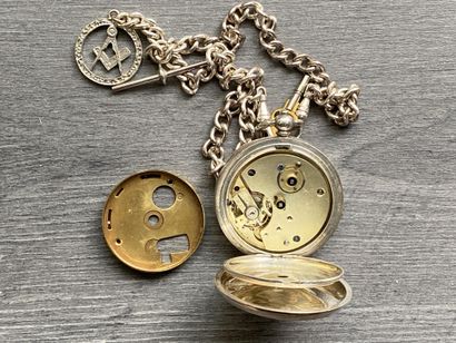 A round steel masonic pocket watch with a...