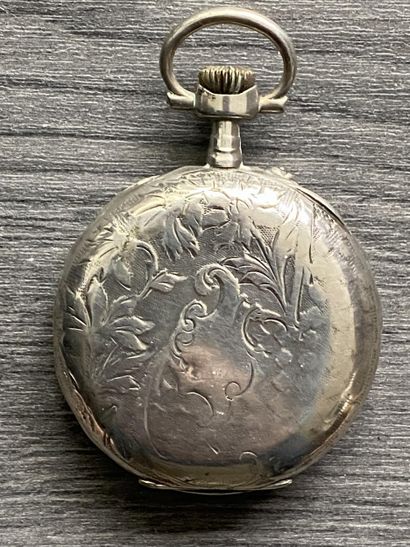 A round steel masonic pocket watch with the...