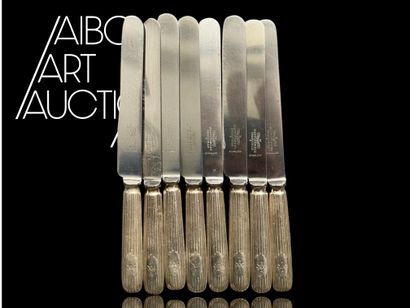 Set of eight silver-plated knives signed...