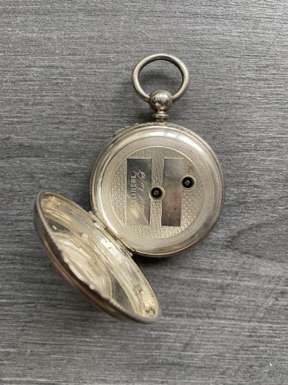 A round steel Masonic pocket watch with black...