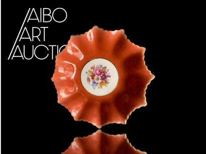 An orphaned saucer with floral decoration...