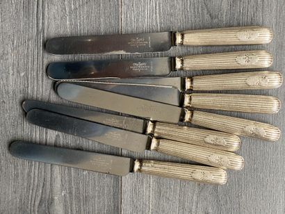 Set of eight silver-plated knives signed...