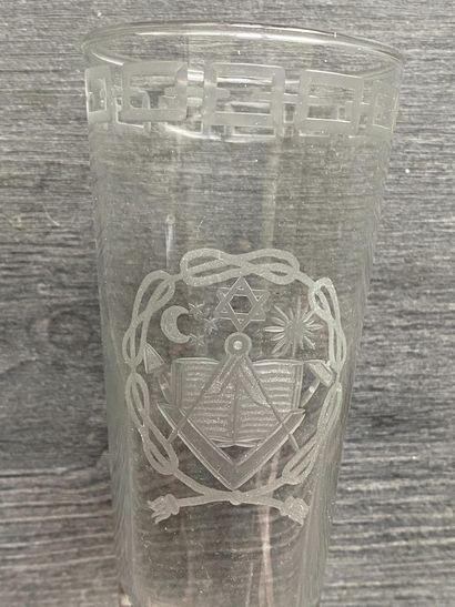 Stemmed glass with engraved symbols of the...