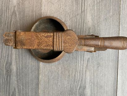 An antique metal cooking utensil for leathering...