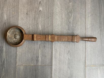 An antique metal cooking utensil for leathering...