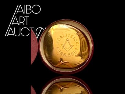 Small pebble-shaped paperweight in gilded...