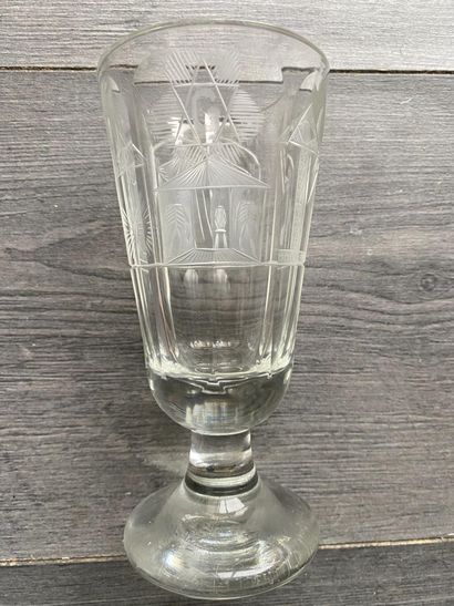 Flared stemmed glass with symbols of the...