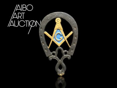 Blackened metal horseshoe with interlaced...
