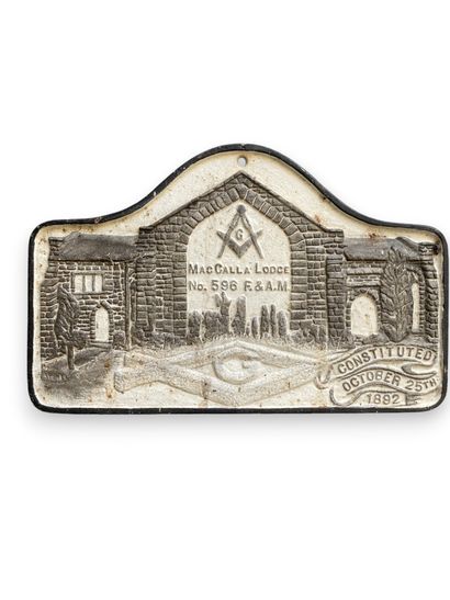 White and gray commemorative cast-iron plaque...