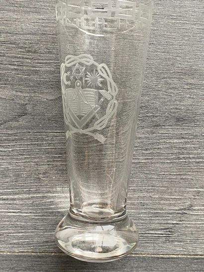Stemmed glass with engraved symbols of the...
