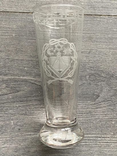 Stemmed glass with engraved symbols of the...
