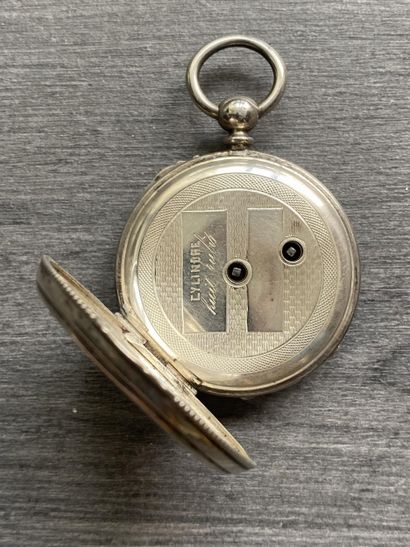 A round steel Masonic pocket watch with black...