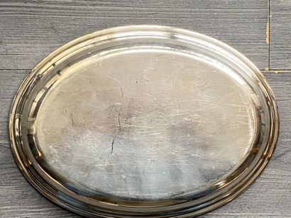 An oval silver plated dish (UK) with an engraving...