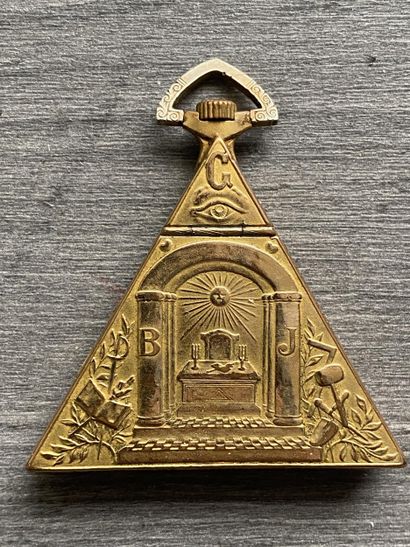 A masonic pocket watch in gilded metal, triangular...