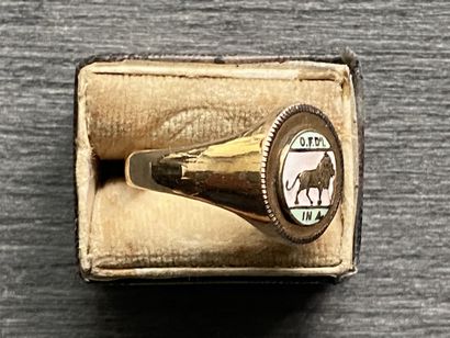 A 10 karat gold ring with enameled scene...