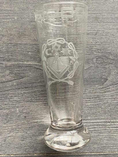 Stemmed glass with engraved symbols of the...