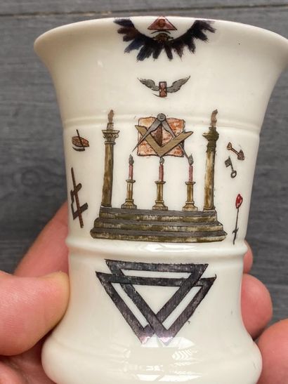 A porcelain goblet with gilded rim and painted...