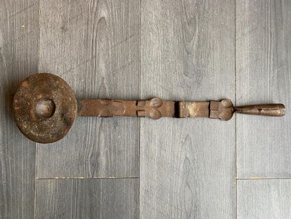 An antique metal cooking utensil for leathering...